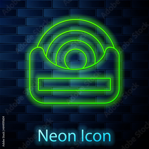 Glowing neon line Dental floss icon isolated on brick wall background. Vector