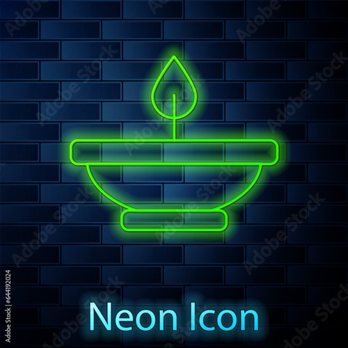 Glowing neon line Aroma lamp icon isolated on brick wall background. Vector