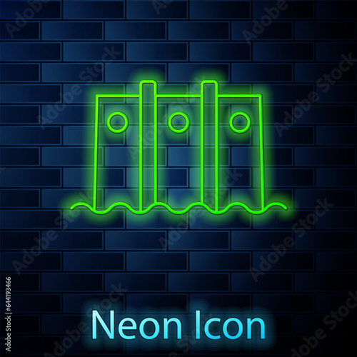 Glowing neon line Hydroelectric dam icon isolated on brick wall background. Water energy plant. Hydropower. Hydroelectricity. Vector