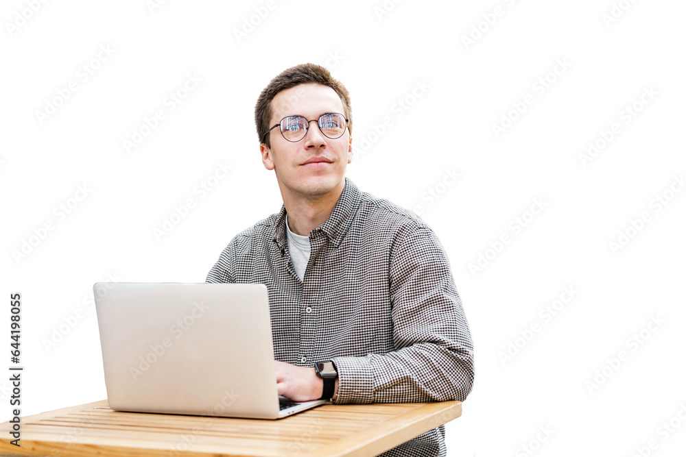 A male freelancer works productively remotely online, uses a laptop and a computer, a workplace in the office. A male freelancer works productively remotely online, uses a laptop and a computer, a workplace in the office.