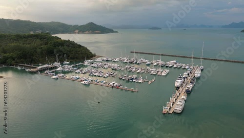 yachts and boats in marina bay at Phuket Thailand Aerial view video footage
