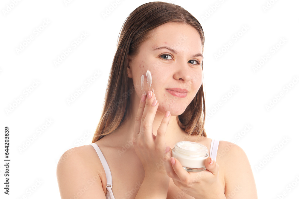 Teenage girl with acne problem applying cream on white background, closeup Teenage girl with acne problem applying cream on white background, closeup