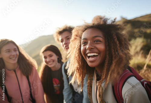Diverse group of teenagers outdoors in nature, young friends exploring , active lifestyle, smiling, happy