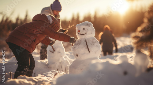 family building a snowman together in a winter wonderland at sunset, Christmas holidays banner, AI