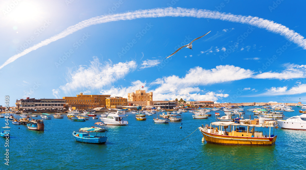 Boats by the seashore of ancient city Alexandria in Egypt