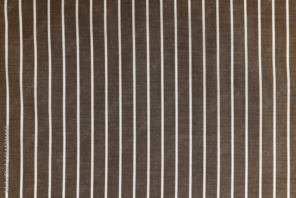 Obraz premium Striped brown white fabric texture background wtih copy space. Shirt fabric, tablecloth textile, garment cloth, upholstery with classic pattern with lines. Backdrop, wallpaper, background.