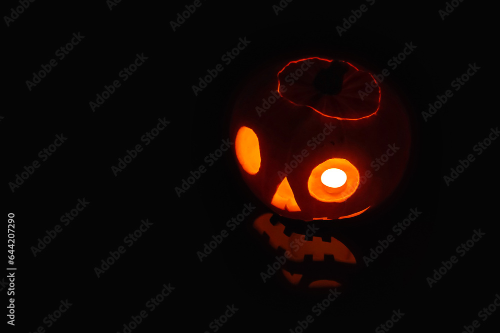 Jack O' Lantern lit in the dark for Halloween Jack O' Lantern lit in the dark for Halloween