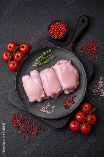 Canvastavla Fresh raw chicken thigh fillets with salt, spices and herbs
