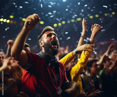 Crowd cheering at a soccer or football stadium and raising hands up. World Cup Concept. Football Concept With a Copy Space. Soccer Concept With a Space For a Text.