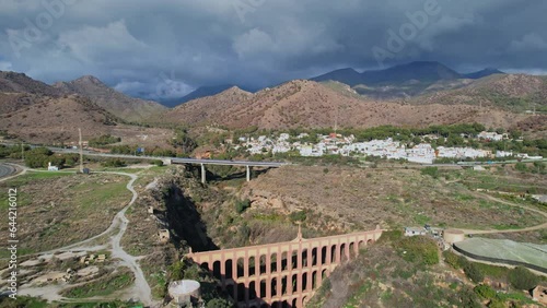 Landscape of a dry valley with Romanstyle aqueduct photo