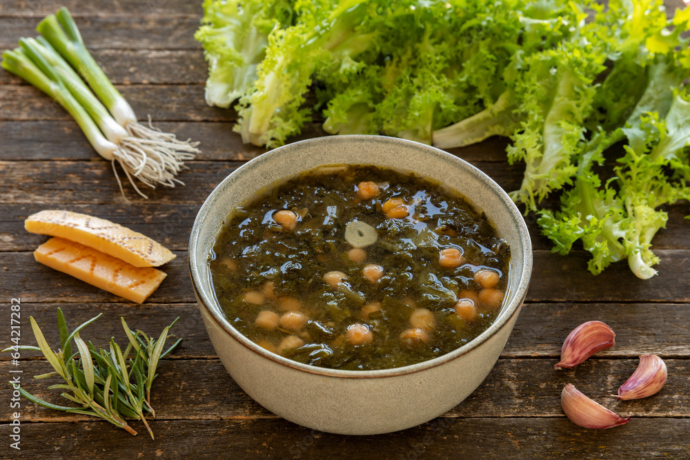 Curly endive and chickpea soup. Main ingredients shown curly endive