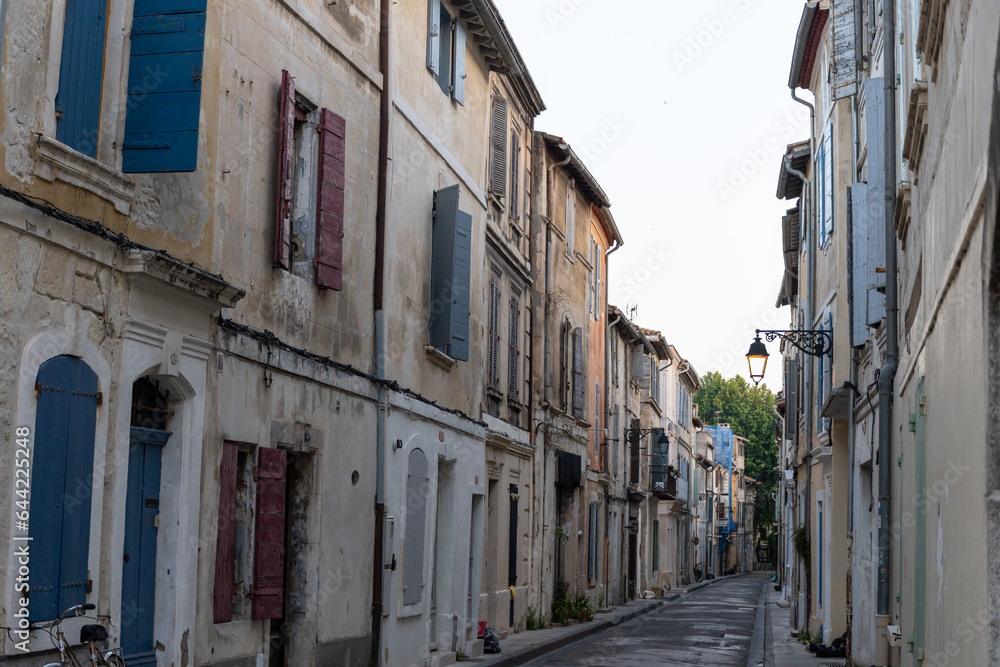 View on old streets and houses in ancient french town Arles, touristic destination with Roman ruines, Bouches-du-Rhone, France