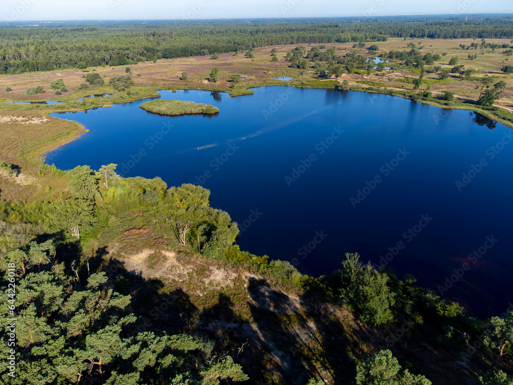 Aerial view on forest and lakes. Sunny morning in Nature protected park area De Malpie near Eindhoven, North Brabant, Netherlands. Nature landscapes in Europe.