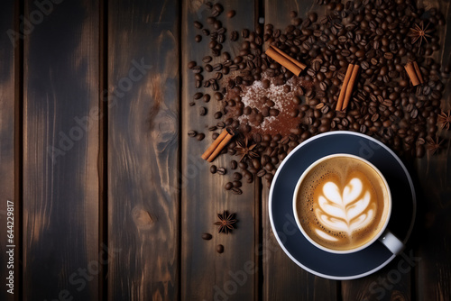 Coffee cup and coffee beans on a wooden background with decorations.