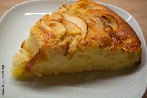 A piece of cake with apple wedges. Apple pie