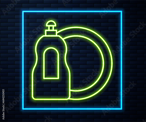 Glowing neon line Dishwashing liquid bottle and plate icon isolated on brick wall background. Liquid detergent for washing dishes. Vector