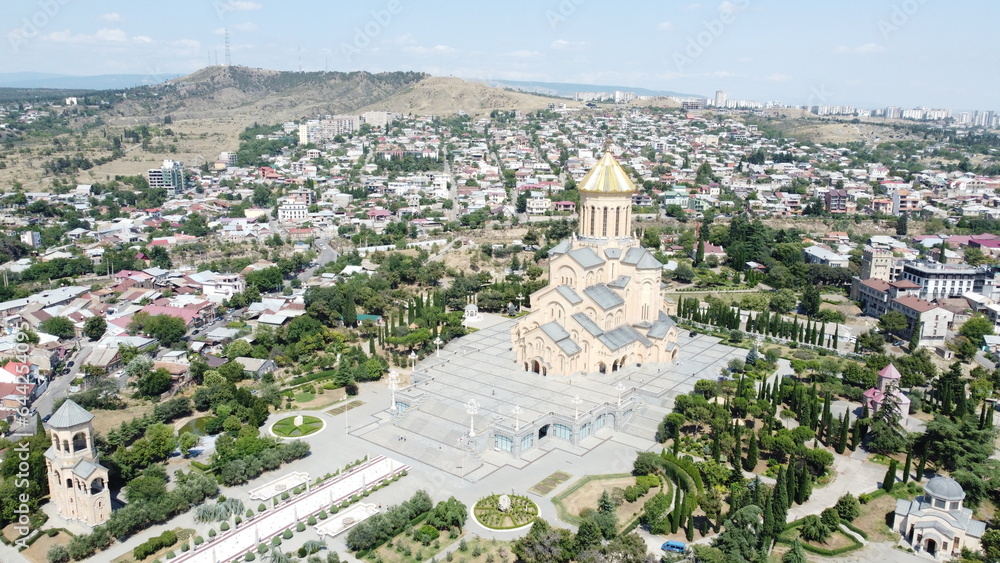 DCIM\101MEDIA\DJI_0154.JPGA drone shot of Holy Trinity (Sameba) Cathedral of Tbilisi highlighting the grandure of the architecture and surrounding complex.