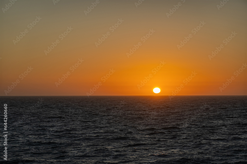 San Francisco, CA, USA - July 13, 2023: 2 of 4, Pacific Ocean sunset west of San Francisco. Blackish water. 