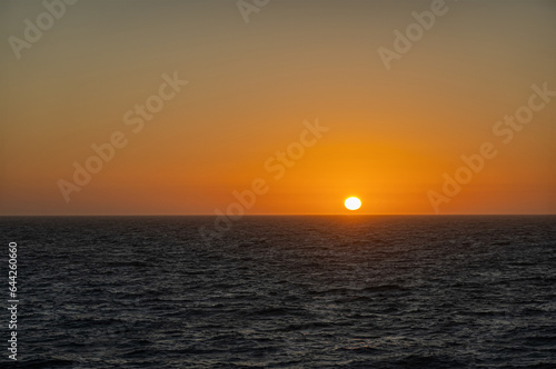 San Francisco, CA, USA - July 13, 2023: 2 of 4, Pacific Ocean sunset west of San Francisco. Blackish water.  © Klodien
