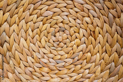 background and texture of braided straw with circular pattern