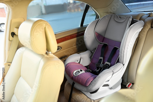 Empty modern child safety seat inside car © New Africa