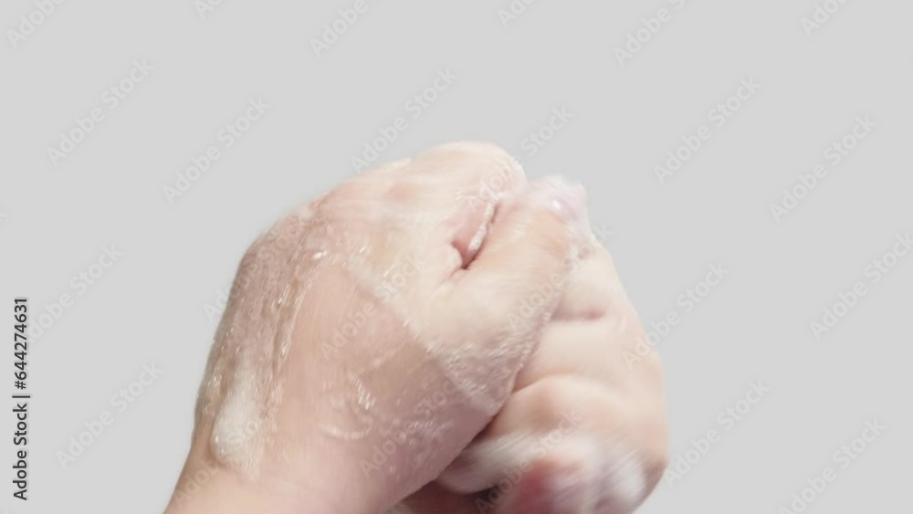Vertical video. Hand hygiene. Infection prevention. Woman washing rubbing cleansing palms fingers skin with soap foam getting rid of bacteria isolated on white background. Vertical video. Hand hygiene. Infection prevention. Woman washing rubbing cleansing palms fingers skin with soap foam getting rid of bacteria isolated on white background.