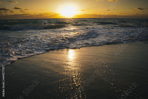 waves and sunrise on the beach