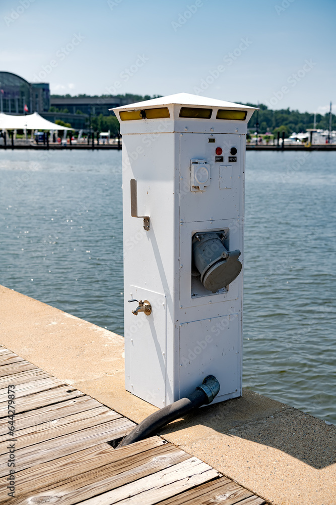 Supply post for water and electricity on a pier head for Yacht Marina