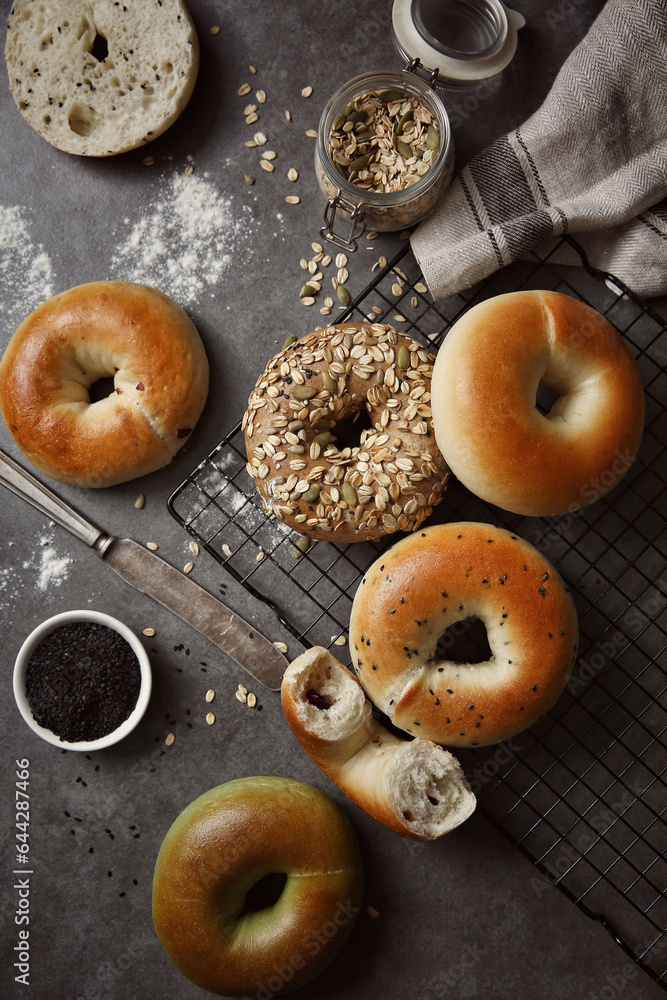Whole wheat alkaline bread, donuts, oatmeal and grain decoration, healthy breakfast, wooden table background indoors