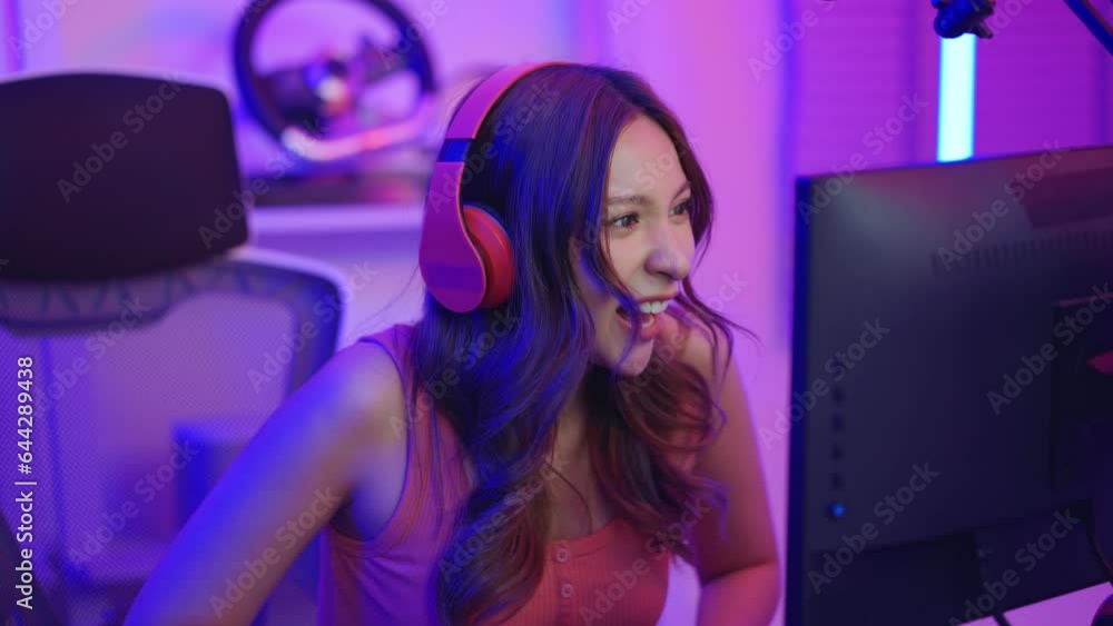 Asian beautiful Esport woman gamer play online video game on computer. Asian beautiful Esport woman gamer play online video game on computer.