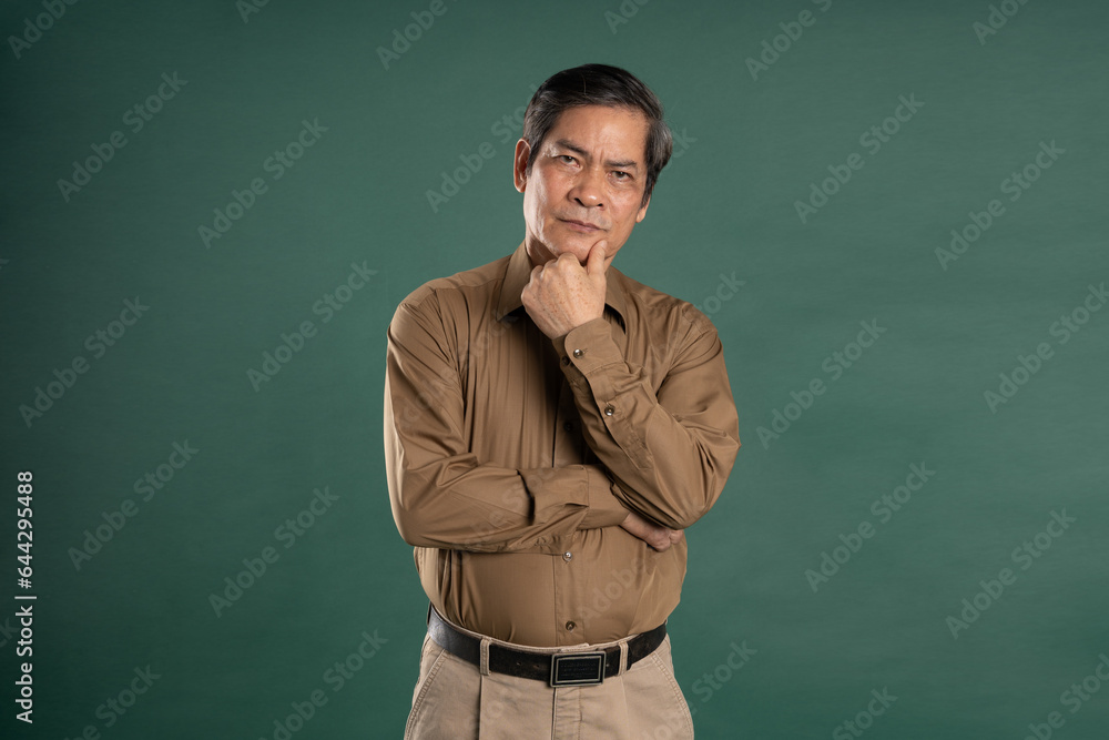 portrait of middle aged asian man posing on blue background portrait of middle aged asian man posing on blue background