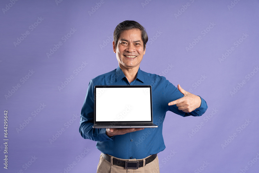 portrait of middle aged asian business man posing on purple background portrait of middle aged asian business man posing on purple background