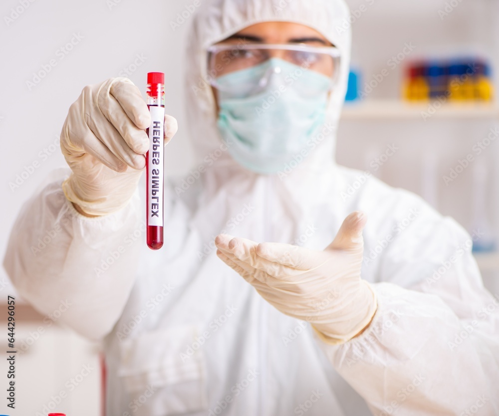Young handsome lab assistant testing blood samples in hospital Young handsome lab assistant testing blood samples in hospital