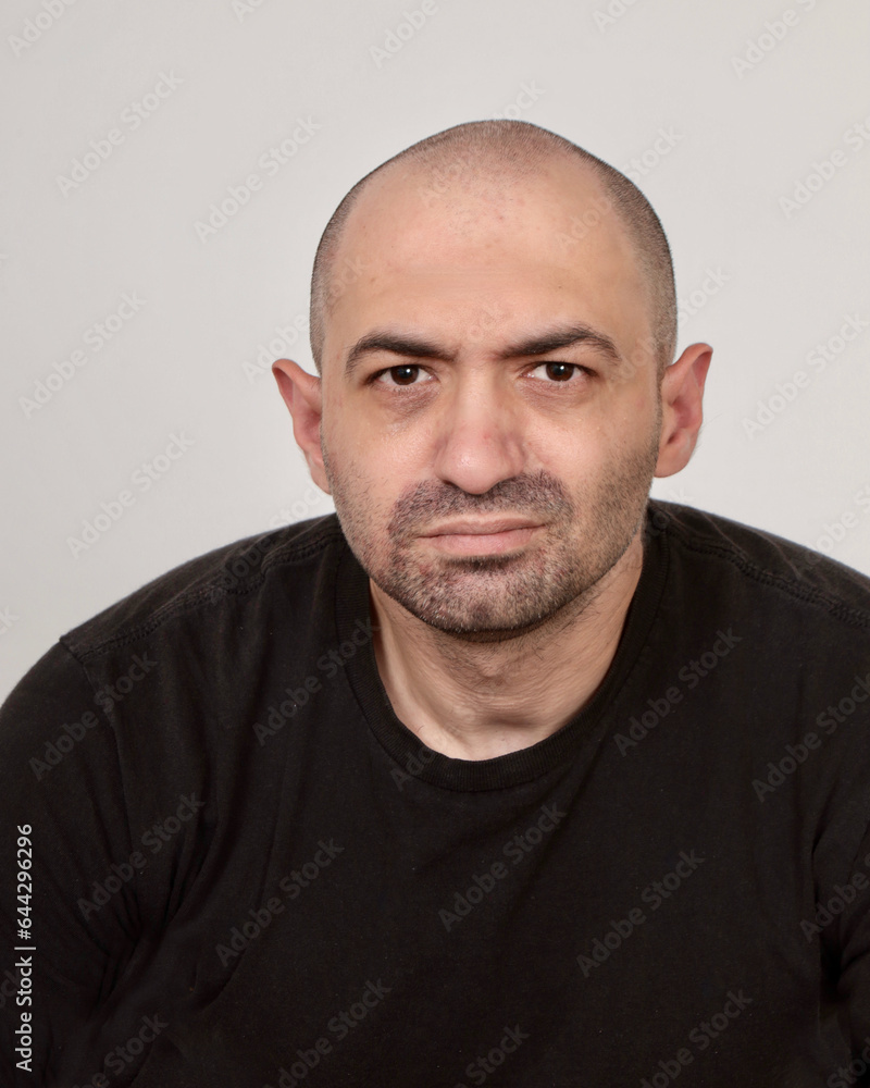 Headshot of middle aged white male wearing a black t-shirt. Headshot of middle aged white male wearing a black t-shirt.