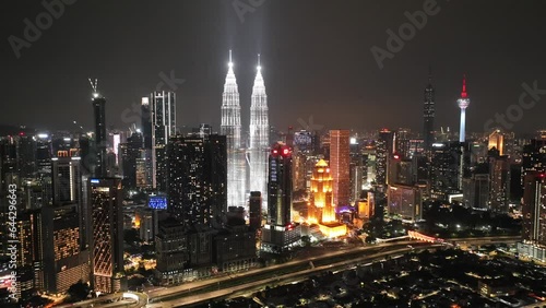 Downtown Kuala Lumpur night timelapse - Aerial drone hyperlapse of KLCC area and Petronas Towers