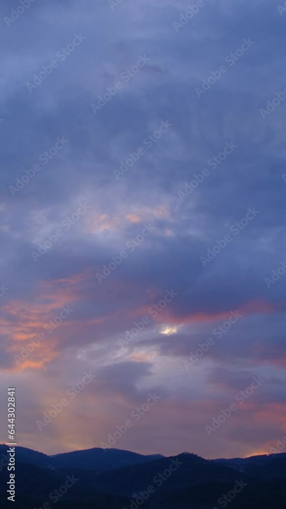 Twilight and dawn sky with cumulus cloud vertical time lapse in an evening. Twilight and dawn sky with cumulus cloud vertical time lapse in an evening.