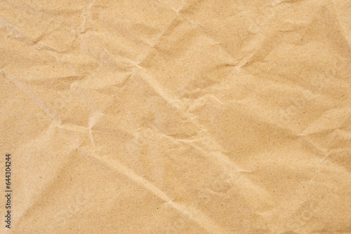 Abstract brown crumpled creased recycle paper texture background