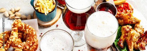 A selection of beer and snacks. Light beer, dark beer, live beer. photo