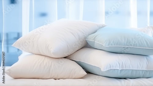 Soft Pillows and blanket on bed.