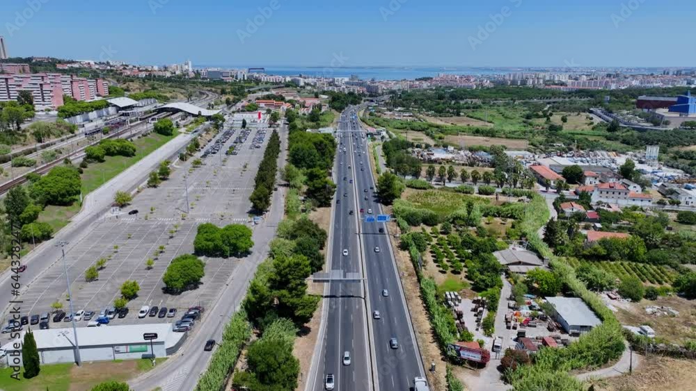 Drone shot flying over and following the highway in Almada, Portugal. Drone shot flying over and following the highway in Almada, Portugal.