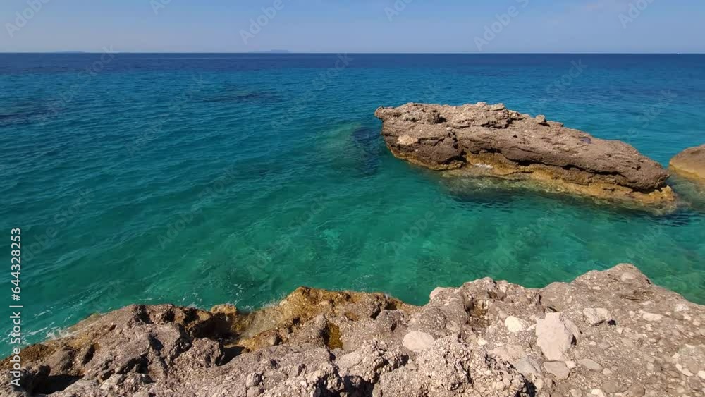 Wild seacoast with cliffs on turquoise sea water, panoramic view of Mediterranean rocky shoreline, concept of summer, travel, relax, hotel, holiday and enjoy Wild seacoast with cliffs on turquoise sea water, panoramic view of Mediterranean rocky shoreline, concept of summer, travel, relax, hotel, holiday and enjoy