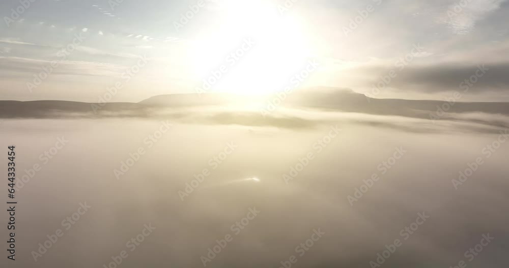 Flying over a foggy Ribblesdale at sunrise Flying over a foggy Ribblesdale at sunrise
