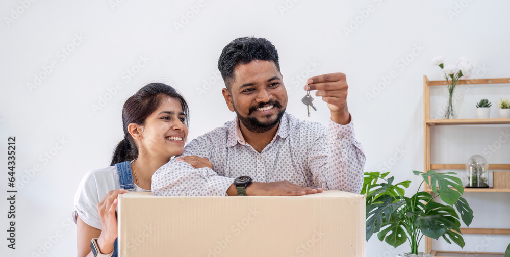 Happy couple showing keys for their new home, Happy house moving. Happy couple showing keys for their new home, Happy house moving.