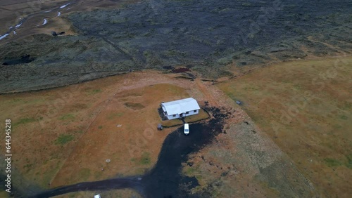 Lonely house in the middle of Iceland's wild terrain, Drone Shot photo