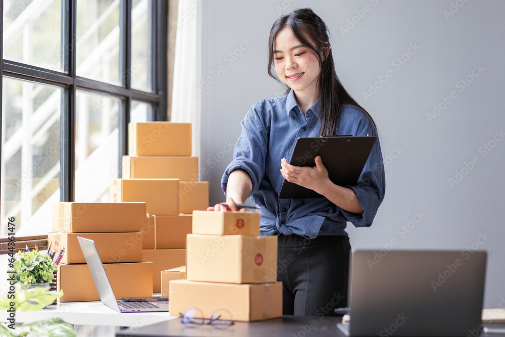 Small business aspiring young asian entrepreneur SME, small and medium business freelance worker working in a home office.SME online business ideas. Small business aspiring young asian entrepreneur SME, small and medium business freelance worker working in a home office.SME online business ideas.