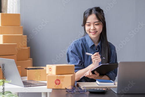 Small business aspiring asian entrepreneur SME, small and medium business freelance worker working in a home office.SME online business ideas.