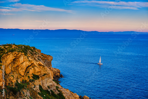 Obraz na płótnie Sailboat navigating in Aegean sea near cape Sounion on sunset, Greece w salonie