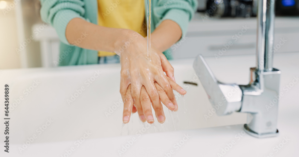 Fototapeta premium Washing hands, woman cleanse and kitchen sink of a female with soap for cleaning and wellness. Home, safety and virus protection of a person with healthcare in a house for skincare and grooming