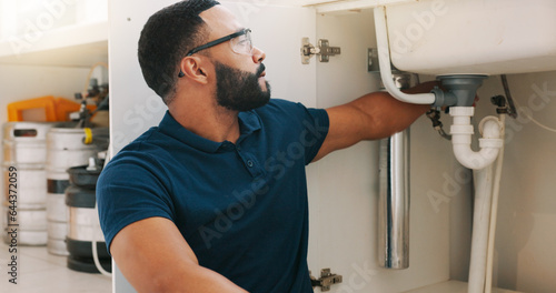 Canvas Print Plumber black man, kitchen and sink maintenance with tools, focus and pipe repair for drainage in home