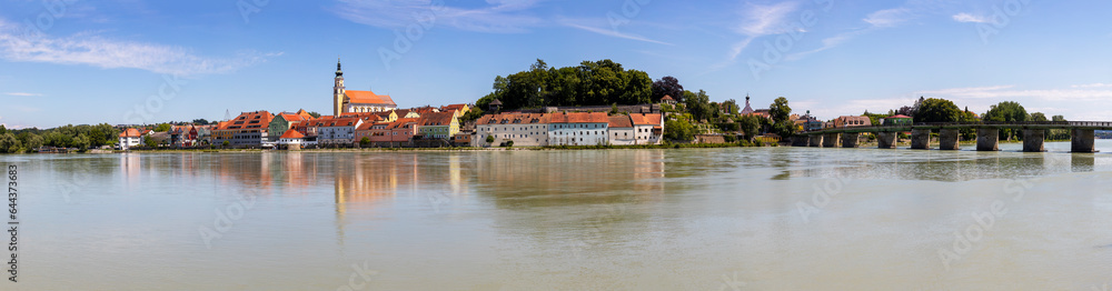 Austria, Upper Austria, Scharding, Panoramic view of Inn river in summer with houses in background Austria, Upper Austria, Scharding, Panoramic view of Inn river in summer with houses in background